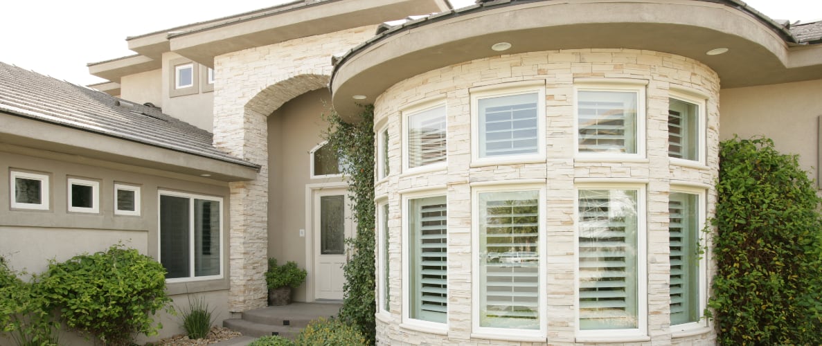 Exterior of home with plantation shutters